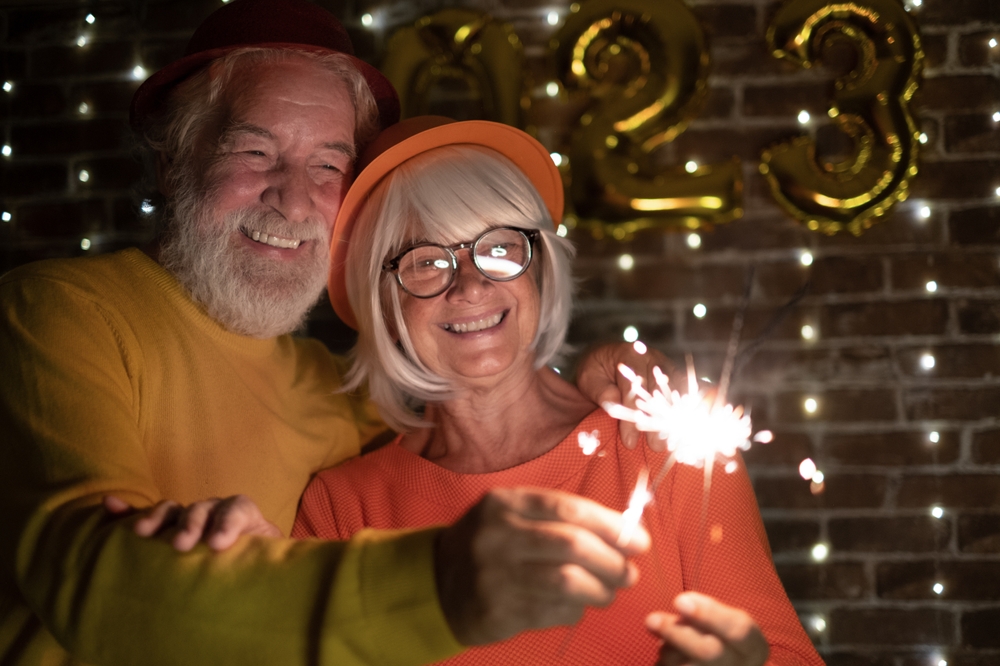 mature couple celebrate new year's with perfect smiles